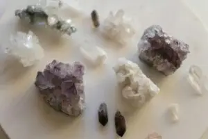 A stunning variety of natural crystals displayed on a marble surface. Perfect for decor or geology enthusiasts.